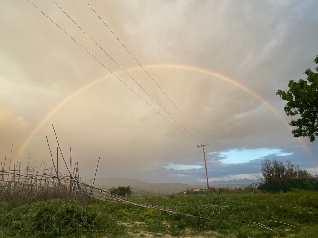 Beautiful rainbow over Zakros. Rain and sunshine at the same time